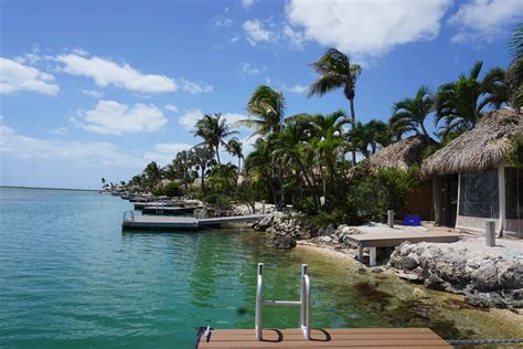 Bluewater key - Make this piece of Paradise your own – Platinum Canal Lot For Sale now at $975,000 Relax in the lush tropical landscaping that surrounds you and provides privacy and shade.